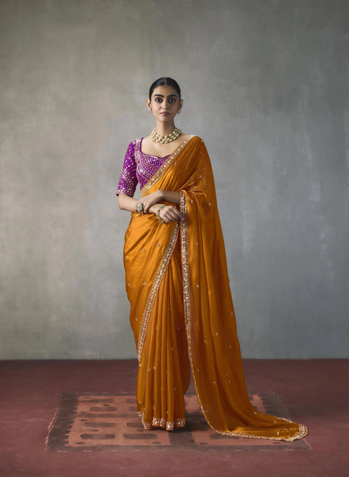 Lightweight Silk Orange Party Wear Cutdana Work Sarees