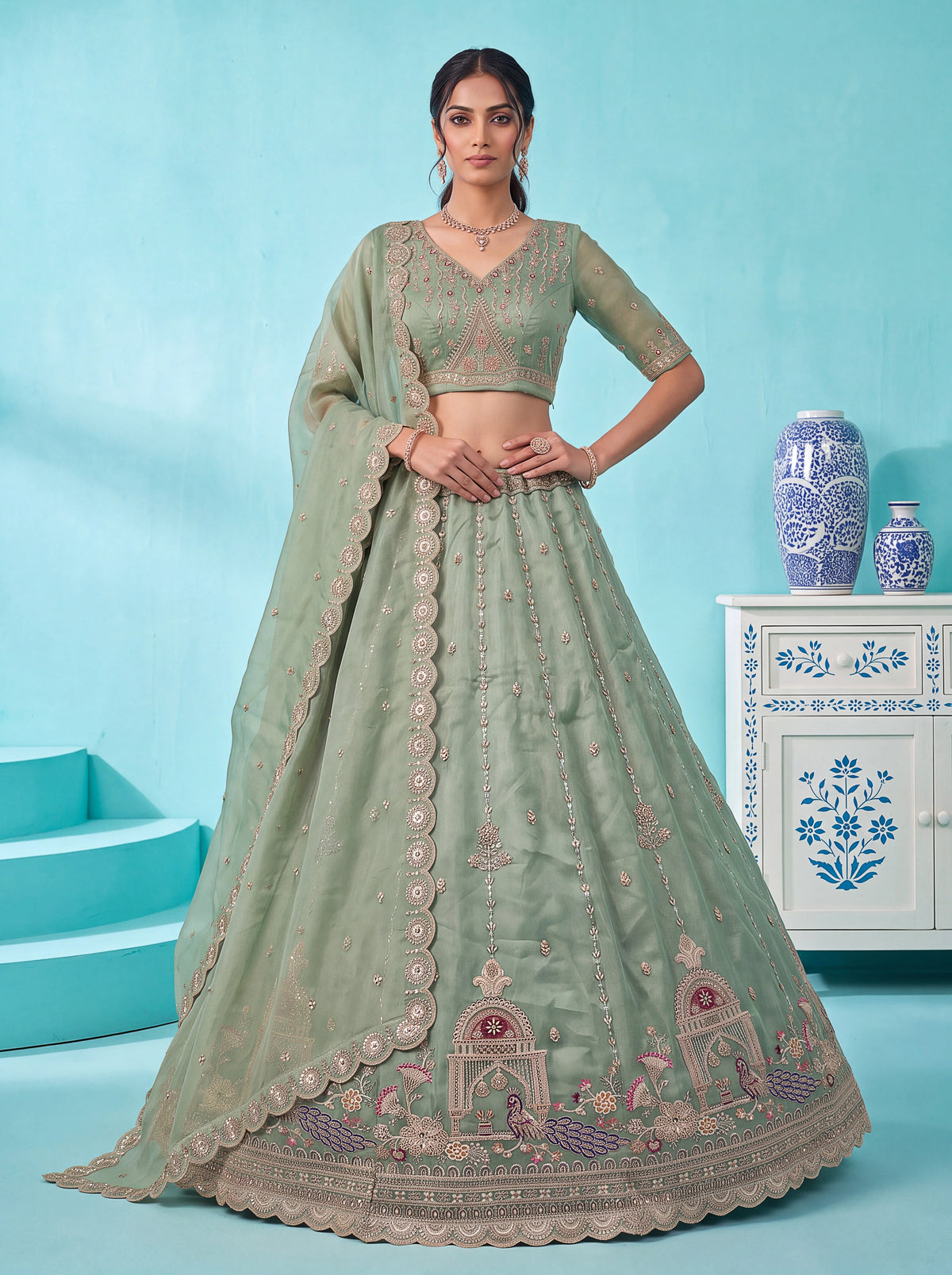 Chandnia Silk Pista Reception Wear Crystal Beads Work Lehengas