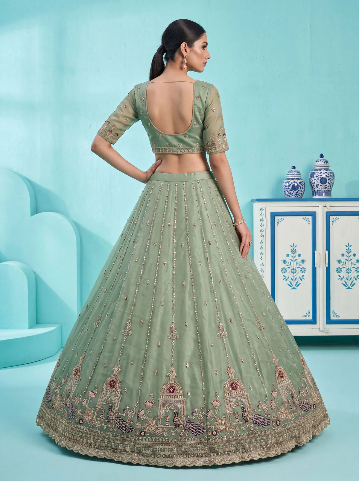Chandnia Silk Pista Reception Wear Crystal Beads Work Lehengas